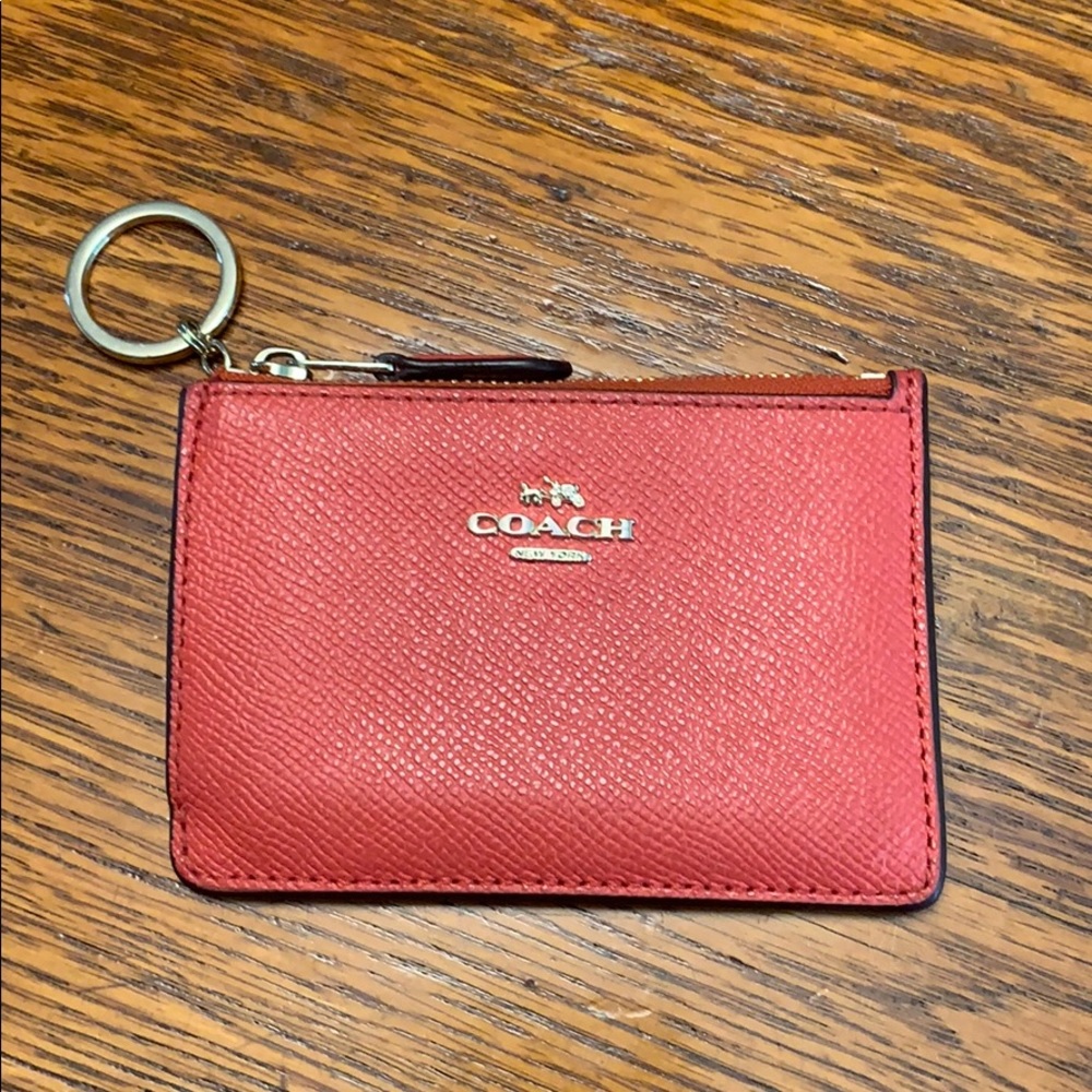 Coach small zip card case with key ring.